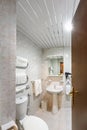 Toilet and detail of a corner shower cabin with wall mount shower attachment Ã¯Â¿Â½Ã¯Â¿Â½ bathroom of hotel Royalty Free Stock Photo